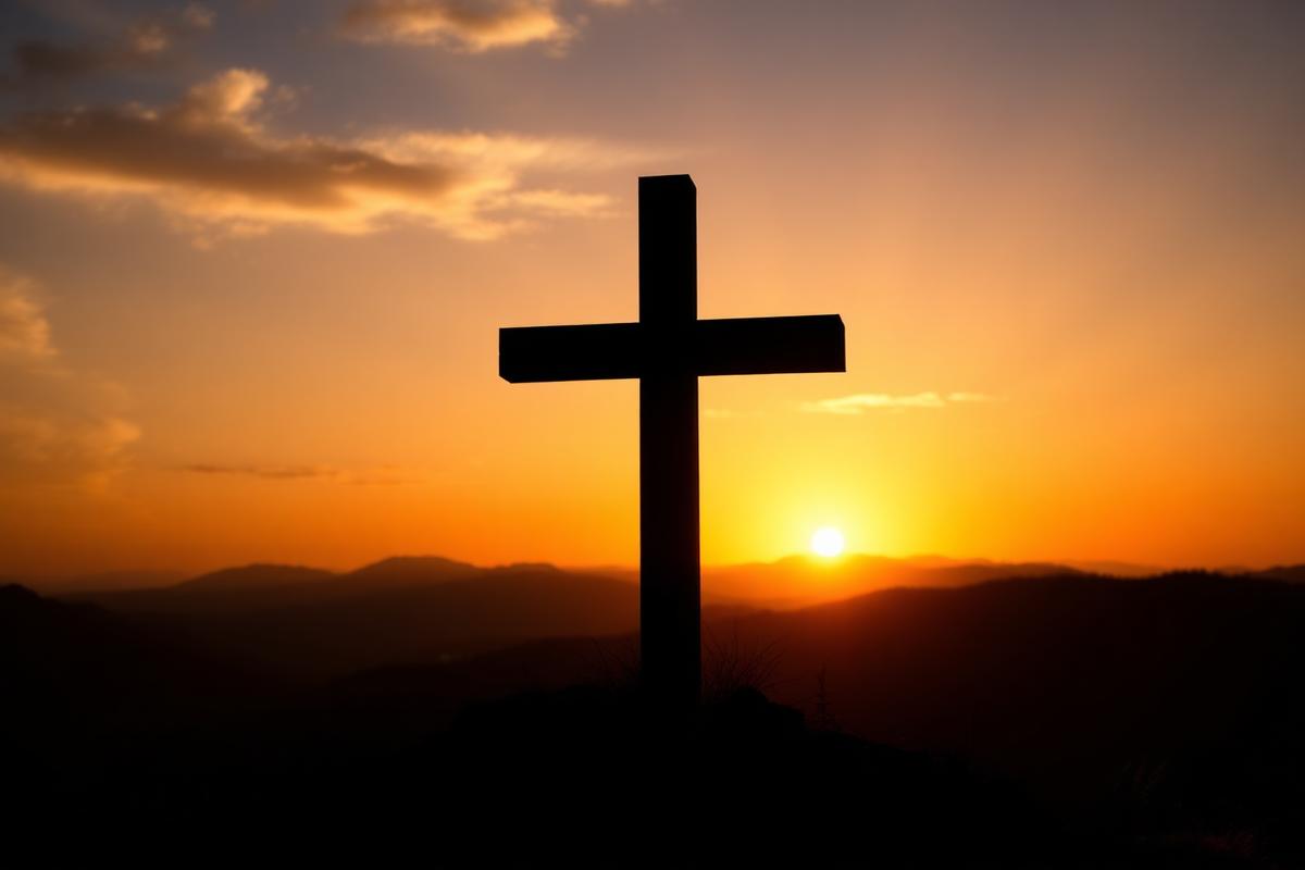 Wooden cross at sunrise